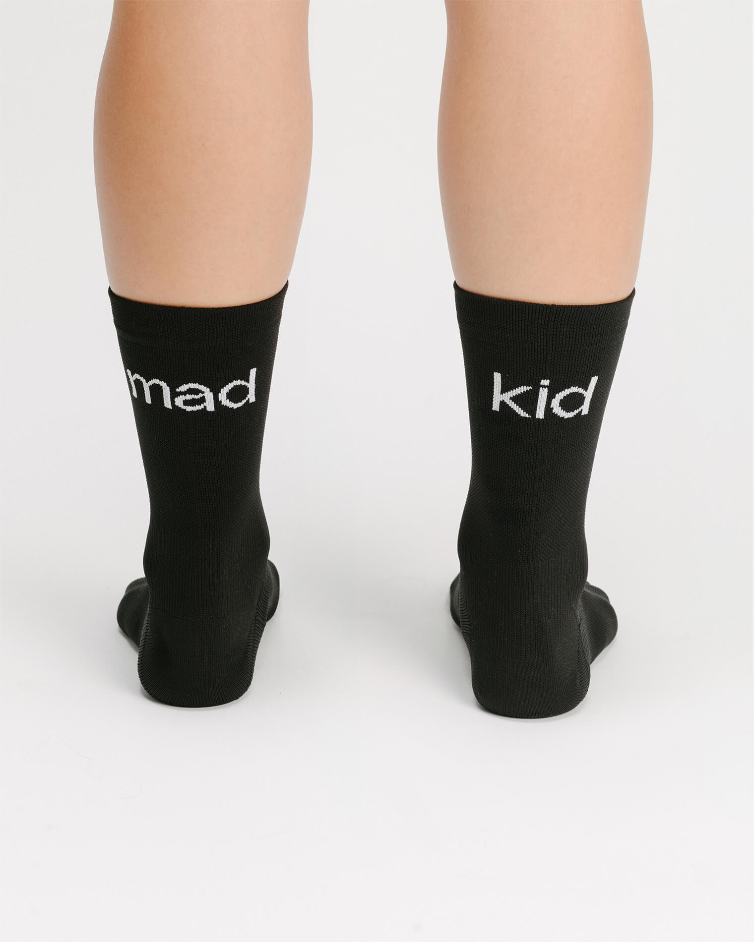 OG 01 black socks worn back on model — madkid logo visible at the back of socks