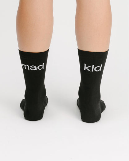 OG 01 black socks worn back on model — madkid logo visible at the back of socks