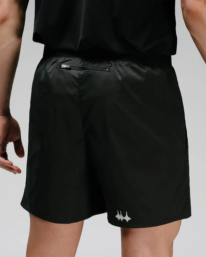 OG 01 men’s shorts back view — lightweight black technical shorts with logo print and elastic waistband by Madkid