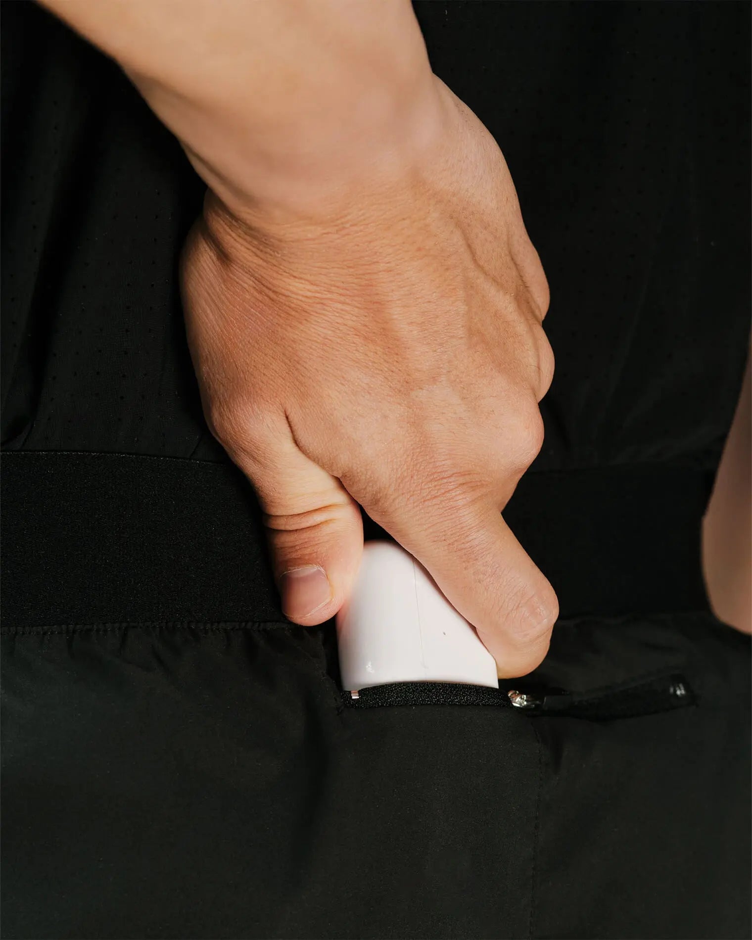 Detail 3 of OG 01 men’s shorts — close-up of back zip pocket, technical lightweight fabric by Madkid