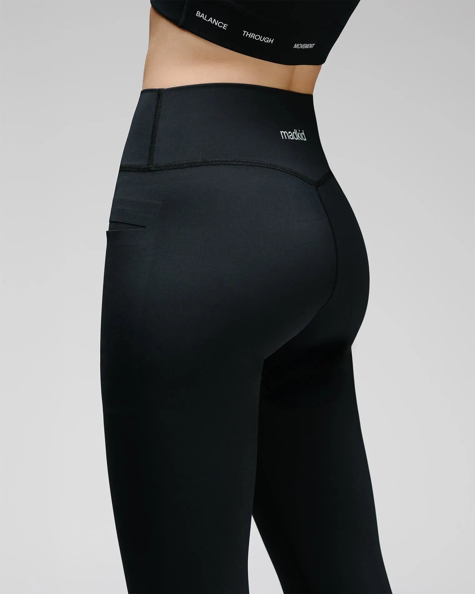 og-01-womens-performance-leggings-back-detail-on-model-madkid