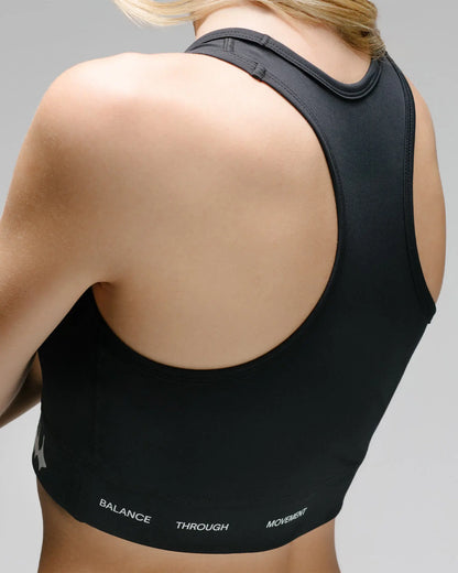 OG 01 women’s performance top back detail on model — close-up of stitching and supportive back panel