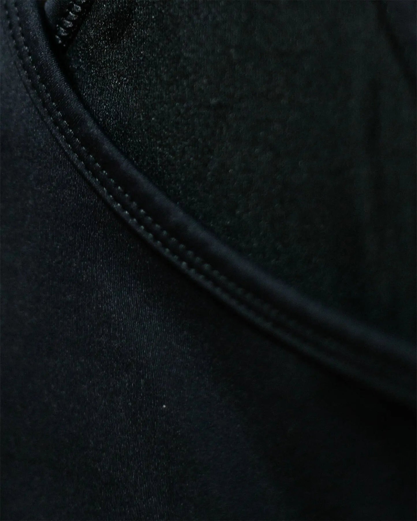 OG 01 women’s performance top fabric detail — macro close-up of technical stretch fabric and stitching by Madkid