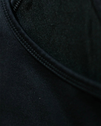OG 01 women’s performance top fabric detail — macro close-up of technical stretch fabric and stitching by Madkid